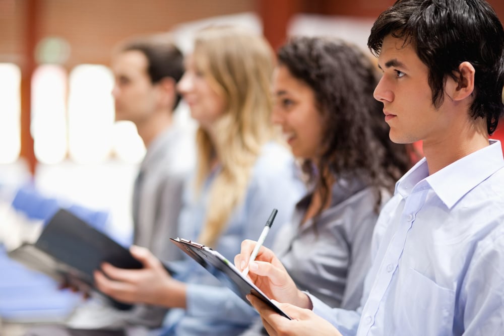 Business people taking notes during a presentation-1